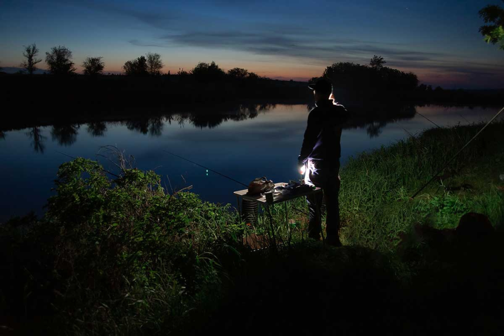 man fishing at night, is night best time to fish?